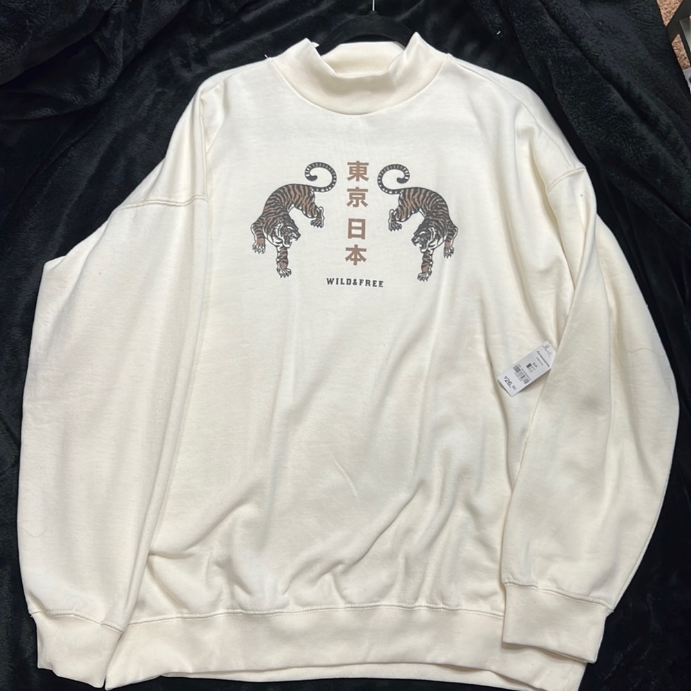 Cream sweater, tiny hole in it bought it like that.